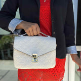 LOUIS VUITTON Pochette Metis Cream Top Handle Empreinte Leather Crossbody
