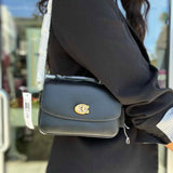 Coach Cassie 17 Black Mini Turnlock Pebbled Leather Top Handle Shoulder Bag