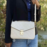 LOUIS VUITTON Pochette Metis Cream Monogram Empreinte Leather Crossbody