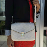 LOUIS VUITTON Pochette Metis Cream Top Handle Empreinte Leather Crossbody