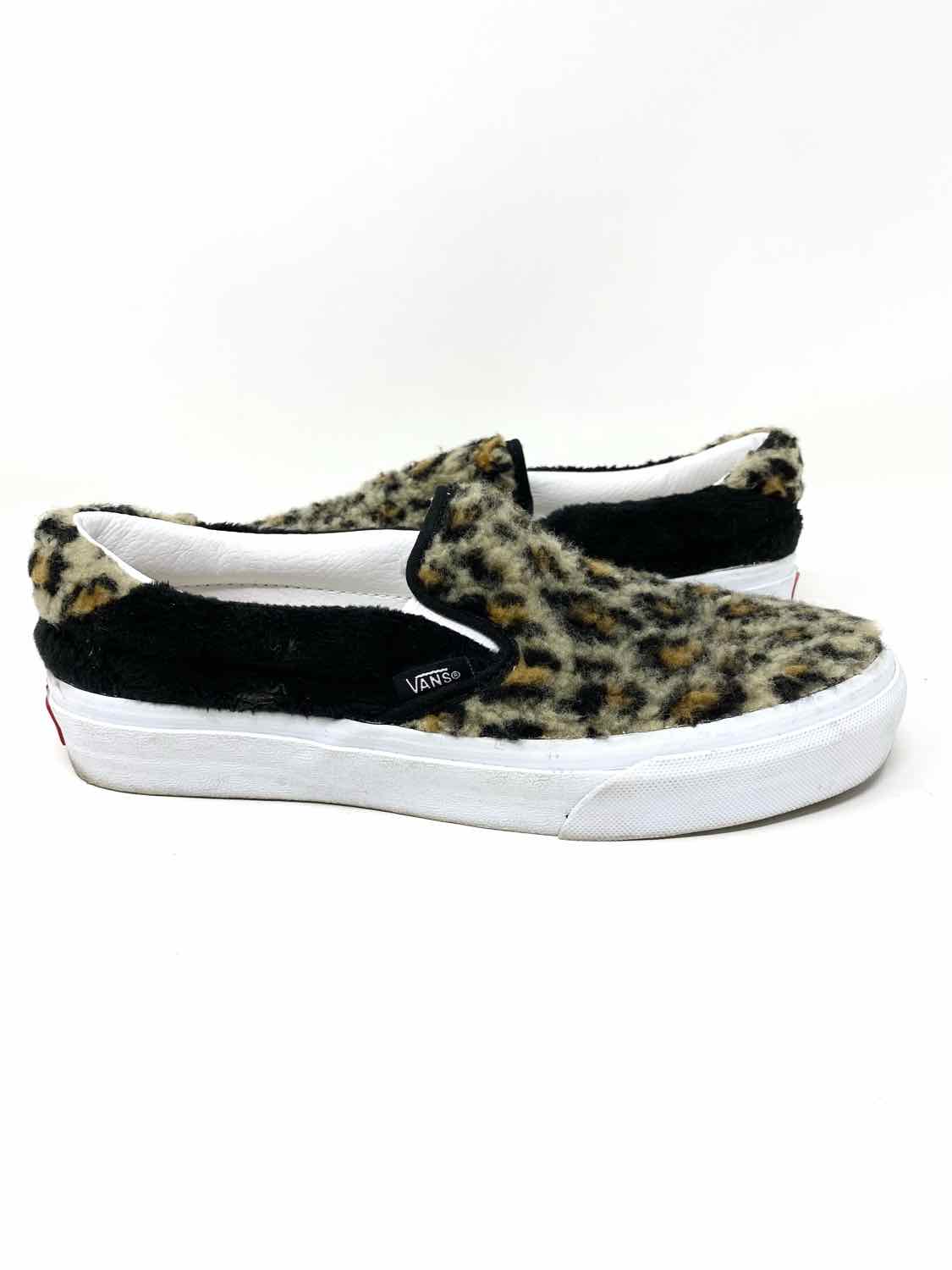 Black vans store with cheetah fur